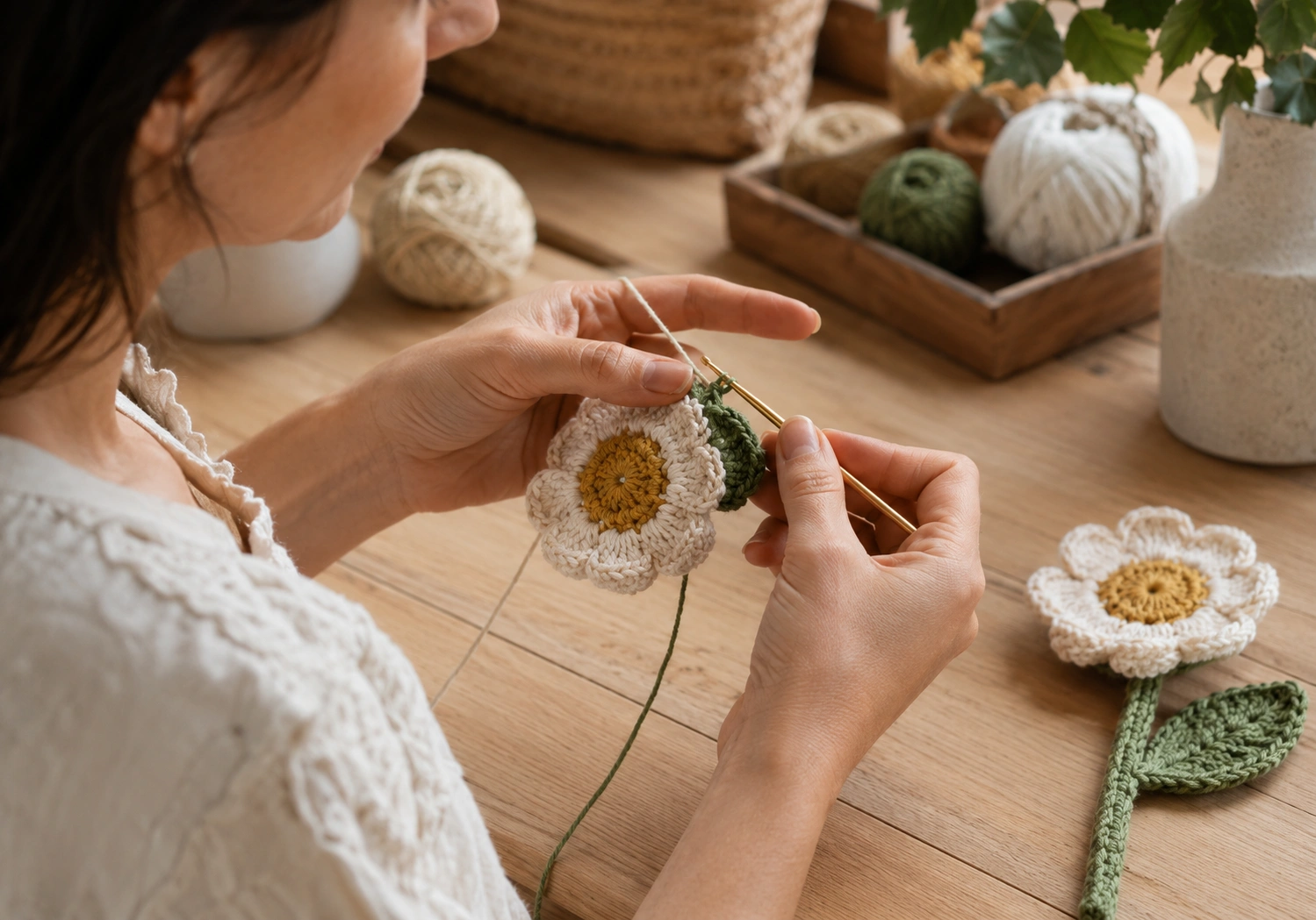 Skilled maker crocheting a detailed flower by hand